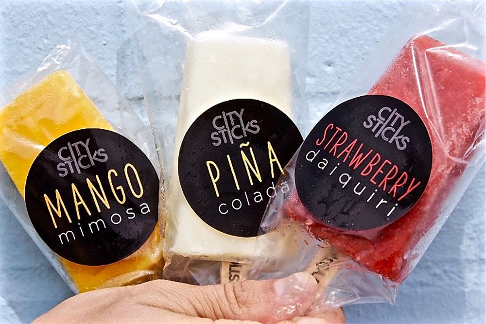 Custom freezer labels on frozen popsicle packs, still flat and legible straight out of the freezer